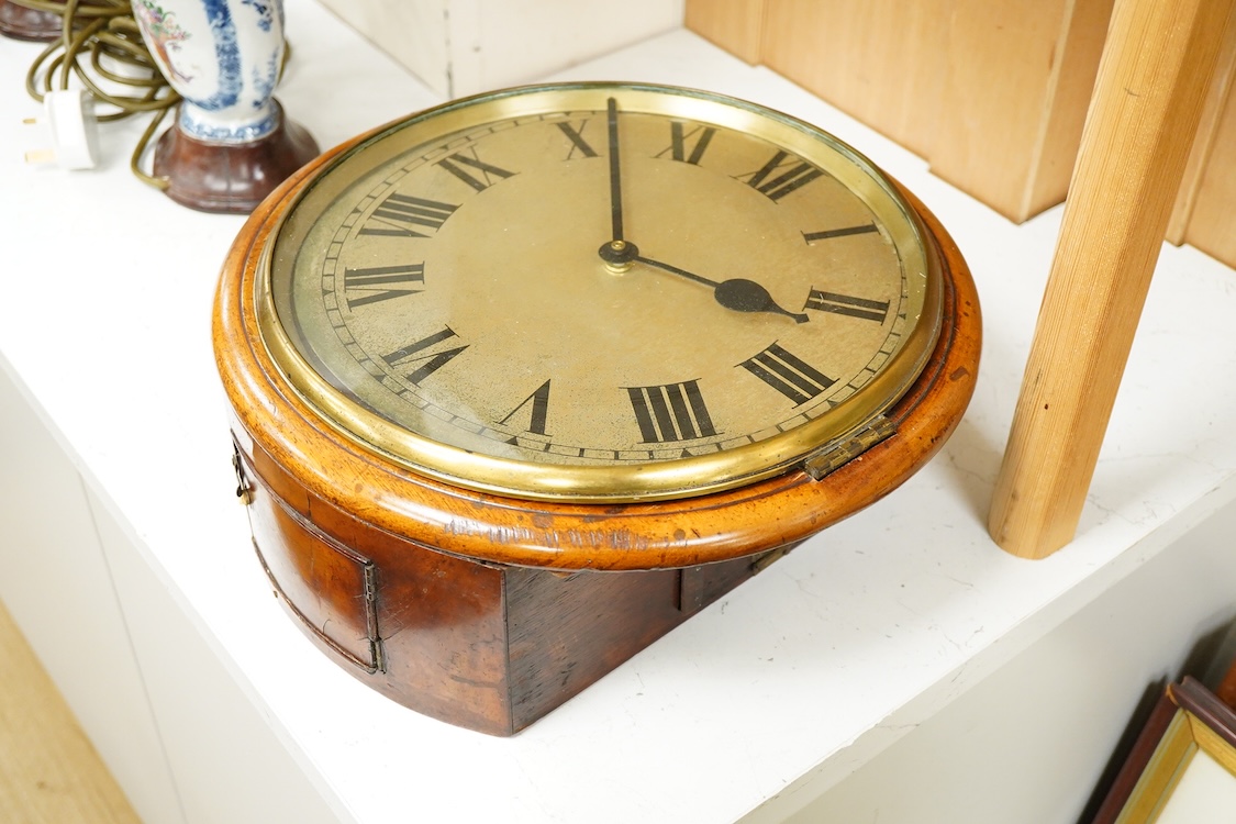 A Victorian wall dial clock case, lacking movement, 37cm in diameter